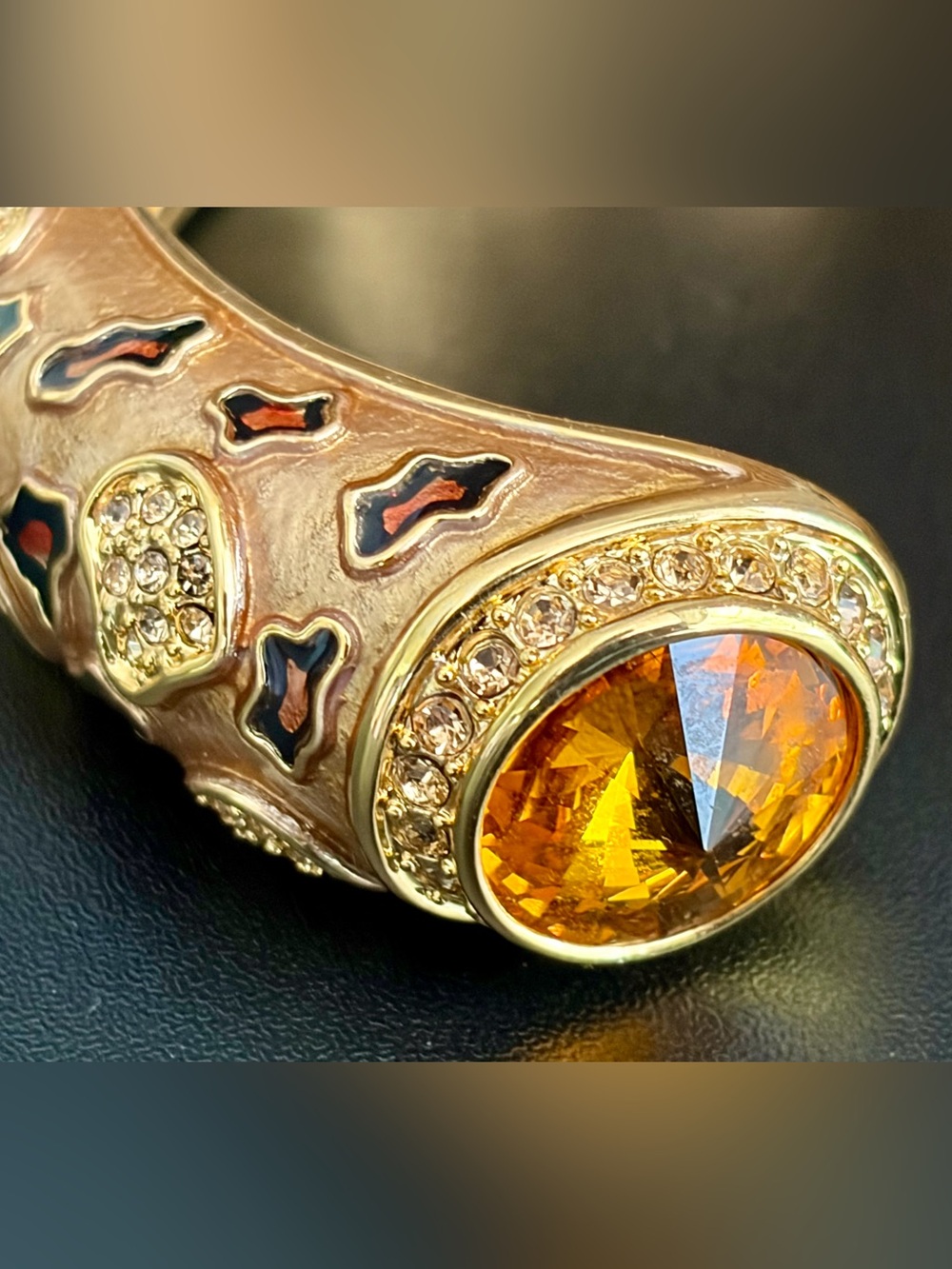 GOLD TONE OPEN CUFF BRACELET WITH ORANGE CITRINE GLASS STONES AND PAVE ACCENTS